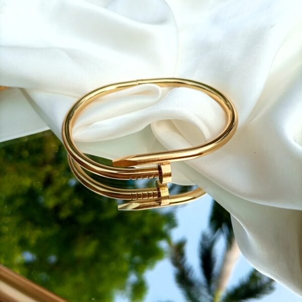 golden nail bracelet