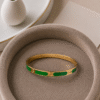 Sleek Bracelet with Green Accent