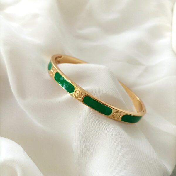 Sleek Golden Bracelet with Green Accent