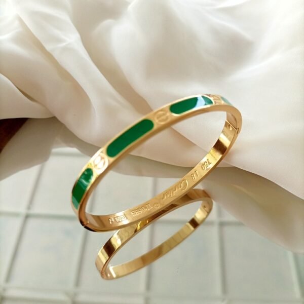 Sleek Golden Bracelet with Green Accent